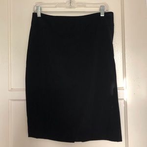 Knee length black skirt.